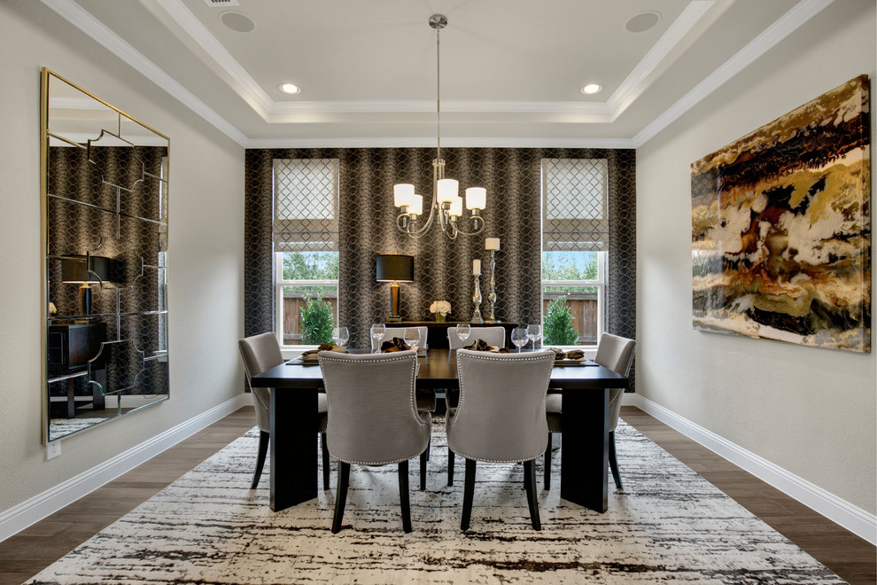This is an example of a mid-sized transitional open plan dining in Dallas with grey walls, medium hardwood floors, no fireplace and brown floor.