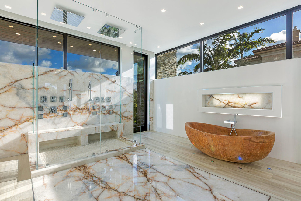Large modern master bathroom in Miami with white cabinets, a freestanding tub, a double shower, white tile, marble, white walls, marble floors, a vessel sink, onyx benchtops, white floor and a hinged shower door.