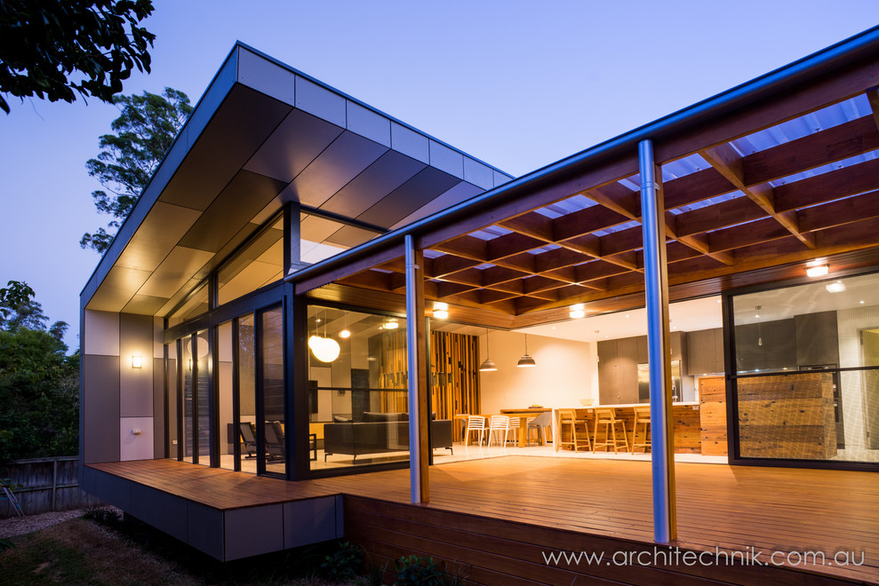 Large modern deck in Sydney with a pergola.