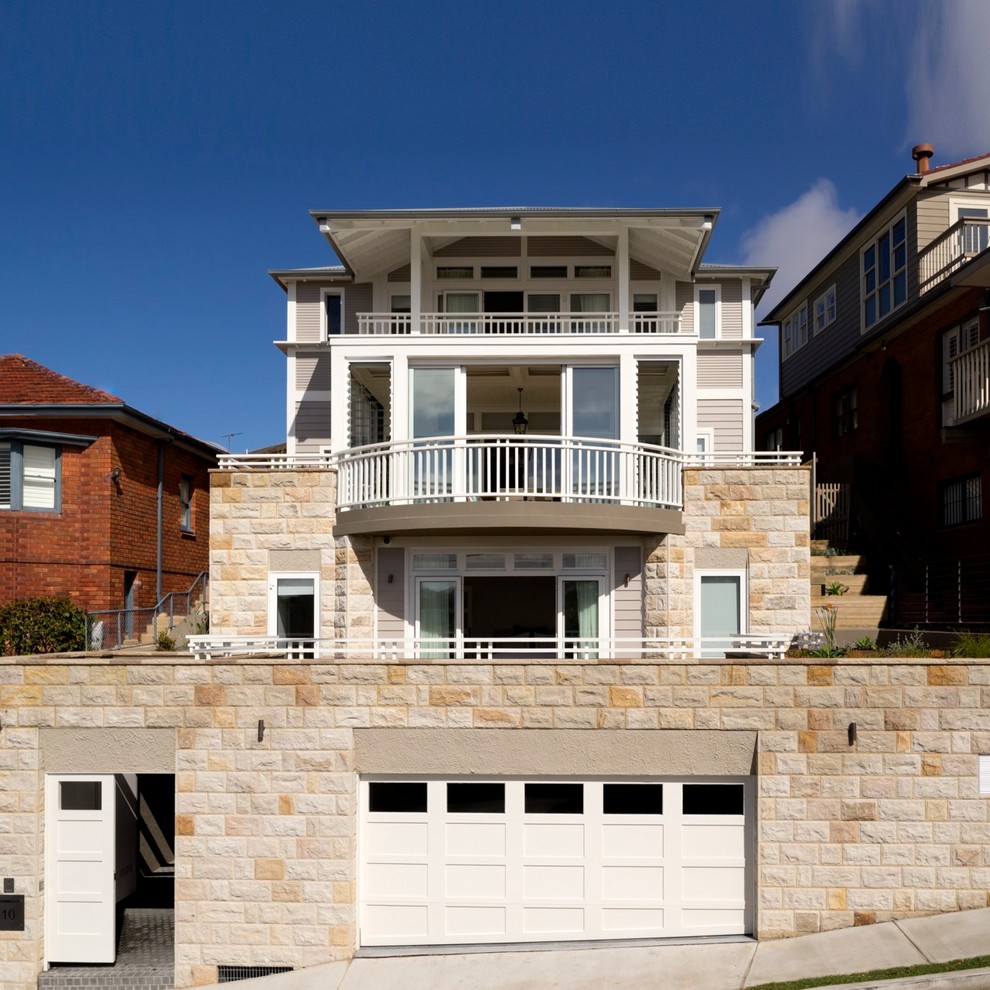 Design ideas for a large beach style two-storey exterior in Sydney.