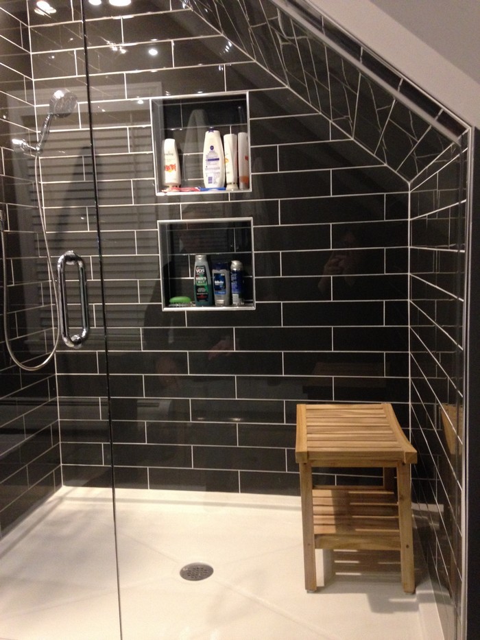 Mid-sized contemporary master bathroom in Bridgeport with white cabinets, black tile, ceramic tile, black walls, porcelain floors, an undermount sink, granite benchtops, recessed-panel cabinets, a corner shower and a one-piece toilet.