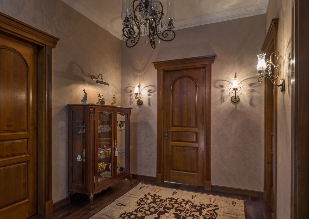 Photo of a large traditional hallway in Other with grey walls and dark hardwood floors.