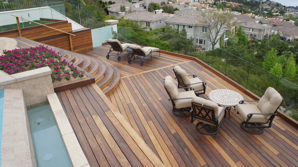 Contemporary patio in Los Angeles with a water feature and decking.