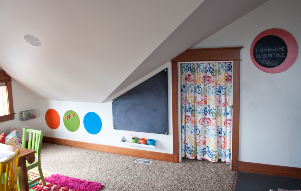 Photo of a large arts and crafts gender-neutral kids' playroom for kids 4-10 years old in Seattle with white walls, carpet and beige floor.