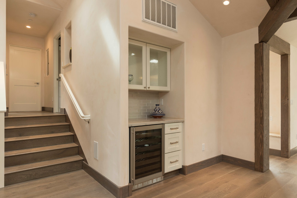 Example of a transitional home bar design in New York