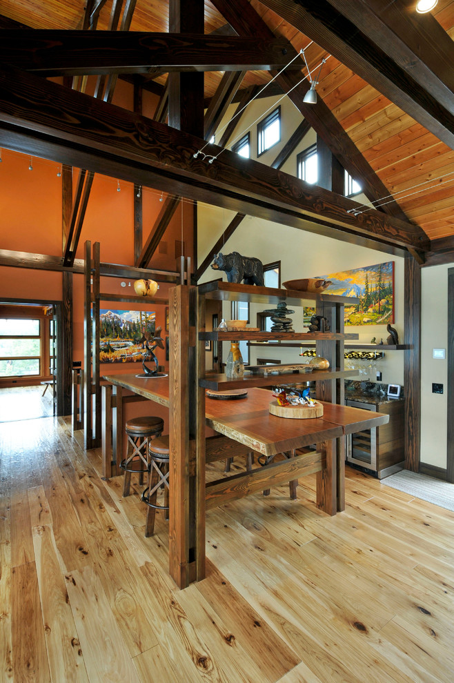 Open concept kitchen - large rustic l-shaped light wood floor open concept kitchen idea in Vancouver with an undermount sink, flat-panel cabinets, dark wood cabinets, stainless steel appliances and an island