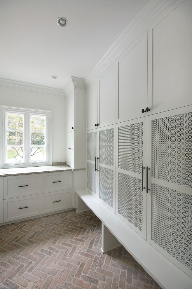 Photo of a mid-sized traditional mudroom in Atlanta with white walls.