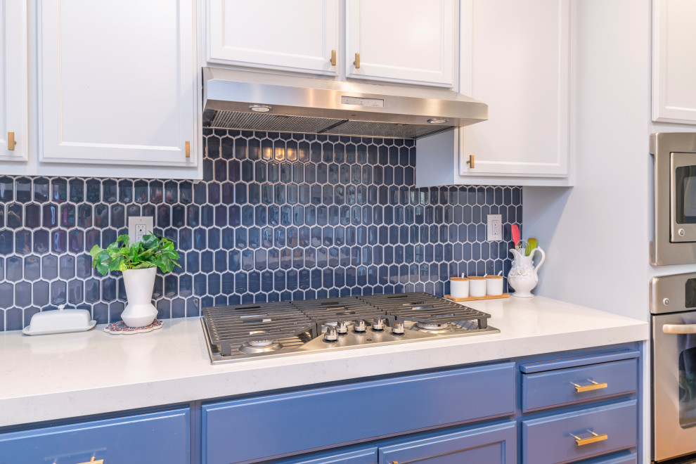 Design ideas for a traditional l-shaped eat-in kitchen in San Francisco with a farmhouse sink, grey cabinets, quartz benchtops, blue splashback, mosaic tile splashback, stainless steel appliances, with island and white benchtop.