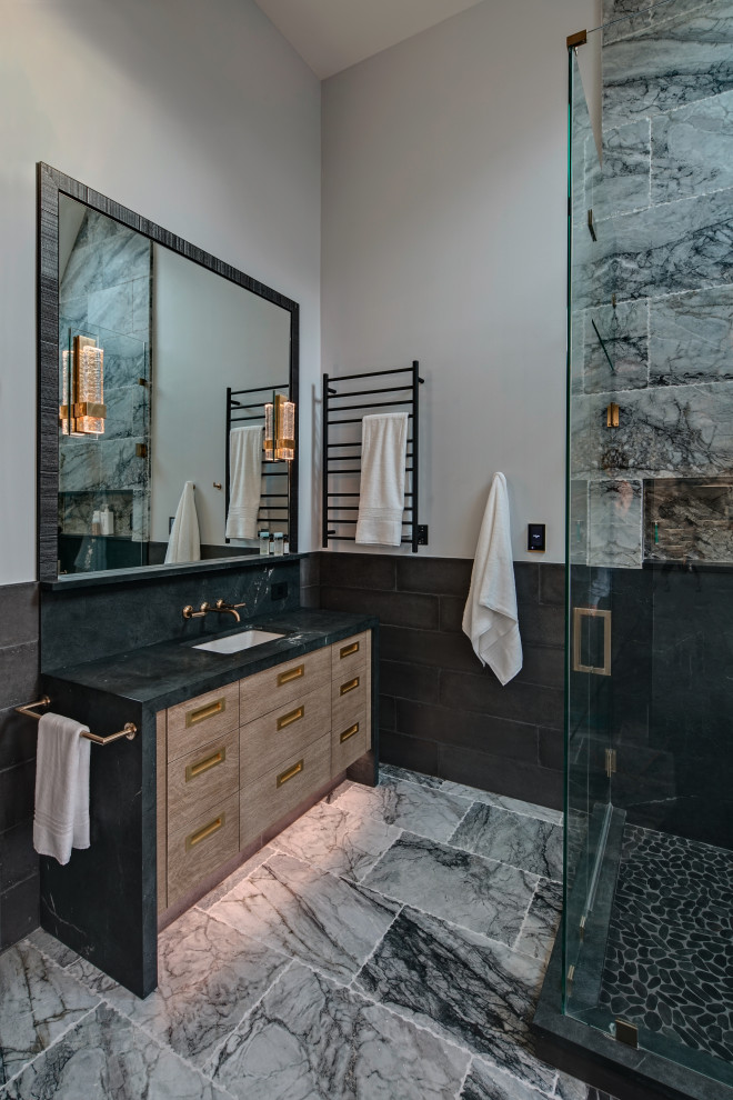 Large contemporary ensuite bathroom in Chicago with flat-panel cabinets, beige cabinets, a corner shower, cement tiles, grey walls, marble flooring, a submerged sink, quartz worktops, grey floors, a hinged door, black worktops, a built in vanity unit and a single sink.