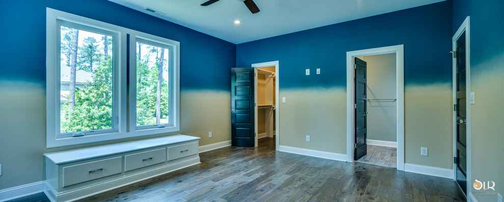Bedroom - transitional light wood floor and beige floor bedroom idea with multicolored walls