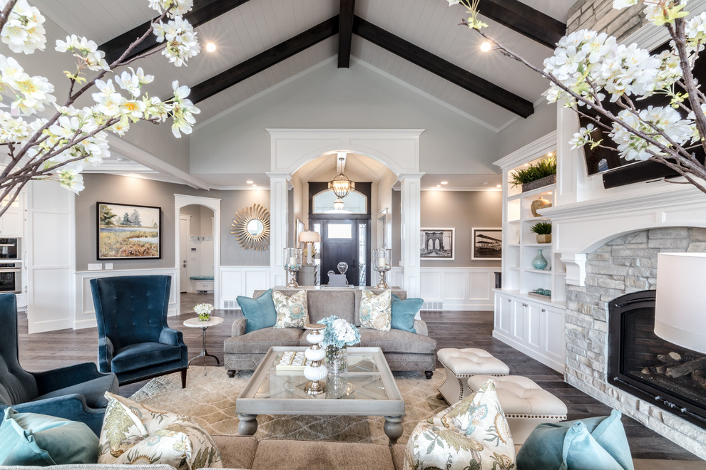 Large traditional formal open concept living room in Salt Lake City with grey walls, dark hardwood floors, a standard fireplace, a stone fireplace surround, a wall-mounted tv and grey floor.