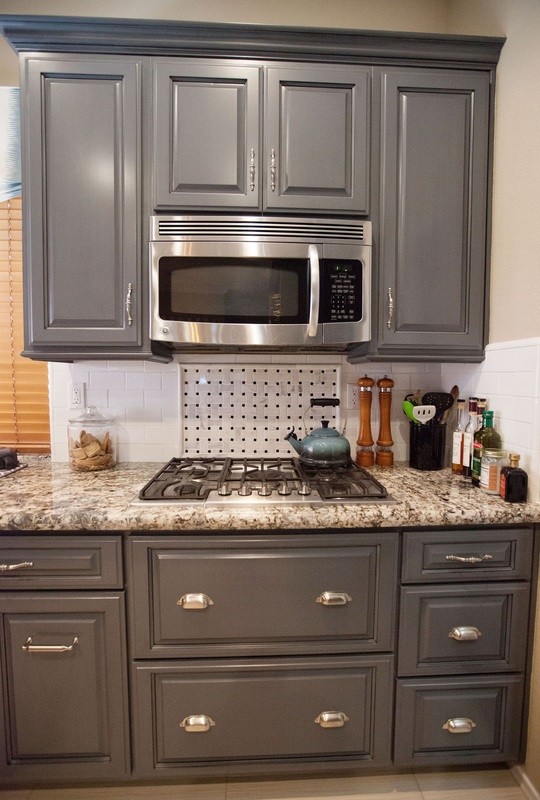 Transitional ceramic tile and beige floor kitchen photo with raised-panel cabinets, gray cabinets, granite countertops, white backsplash, subway tile backsplash and stainless steel appliances