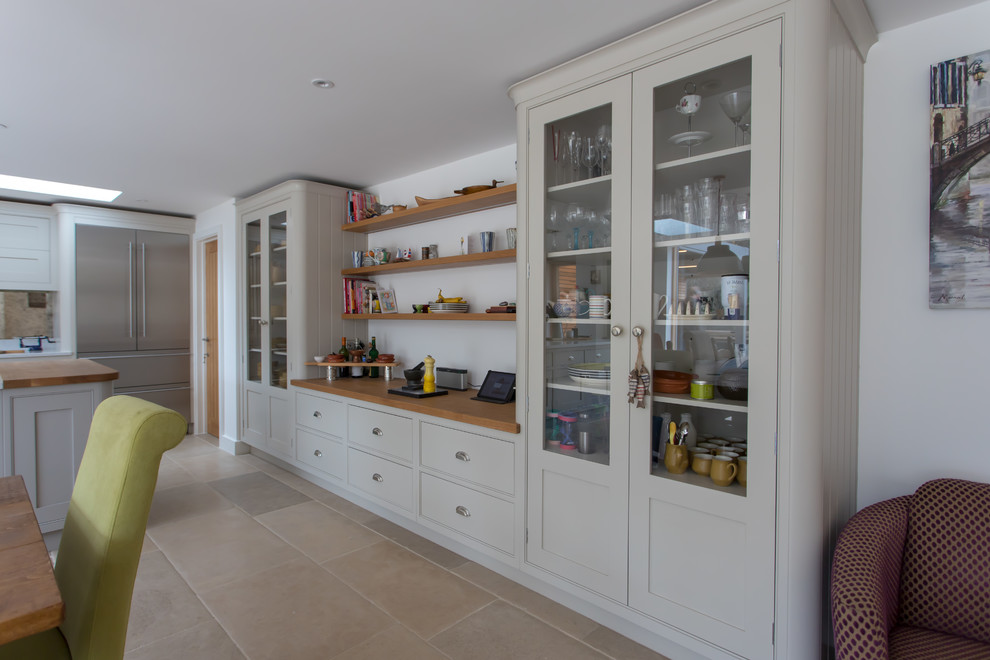 Inspiration for an expansive traditional u-shaped eat-in kitchen in Hertfordshire with a farmhouse sink, shaker cabinets, grey cabinets, quartzite benchtops, metallic splashback, mirror splashback, stainless steel appliances, limestone floors, with island, beige floor and yellow benchtop.