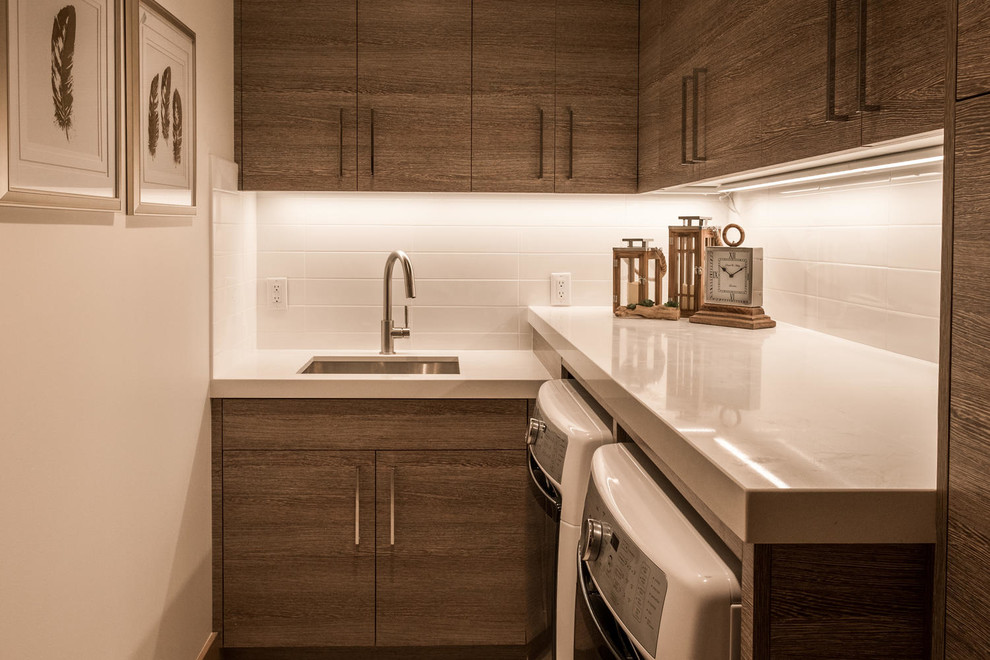 Inspiration for a small transitional l-shaped dedicated laundry room in Salt Lake City with an undermount sink, flat-panel cabinets, medium wood cabinets, quartz benchtops, white walls, a side-by-side washer and dryer and white benchtop.