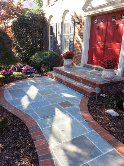 Inspiration for a mid-sized front yard partial sun garden in DC Metro with a garden path and brick pavers.