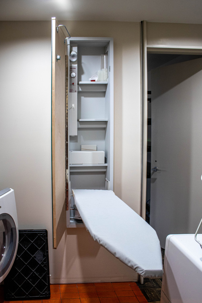 This is an example of a small midcentury utility room in Cleveland.