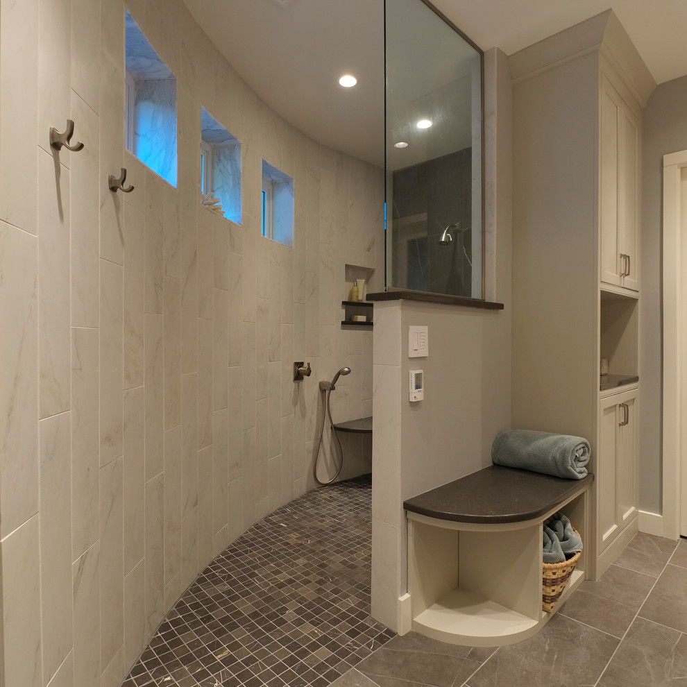 Mid-sized transitional master bathroom in Seattle with an undermount sink, beaded inset cabinets, white cabinets, engineered quartz benchtops, a curbless shower, a two-piece toilet, gray tile, porcelain tile, blue walls and porcelain floors.