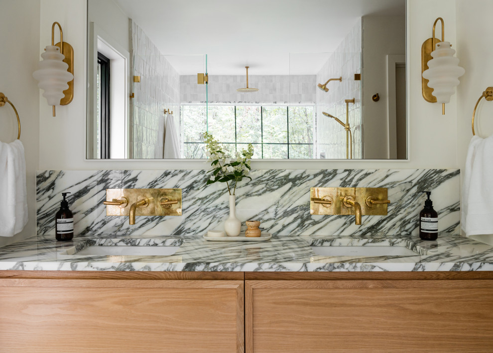 Mid-sized transitional master white tile and porcelain tile double-sink freestanding bathtub photo in Chicago with shaker cabinets, light wood cabinets, white walls, an undermount sink, marble countertops, a hinged shower door, white countertops and a built-in vanity