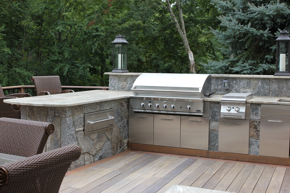 Large transitional backyard deck photo in Bridgeport with a fire pit and no cover