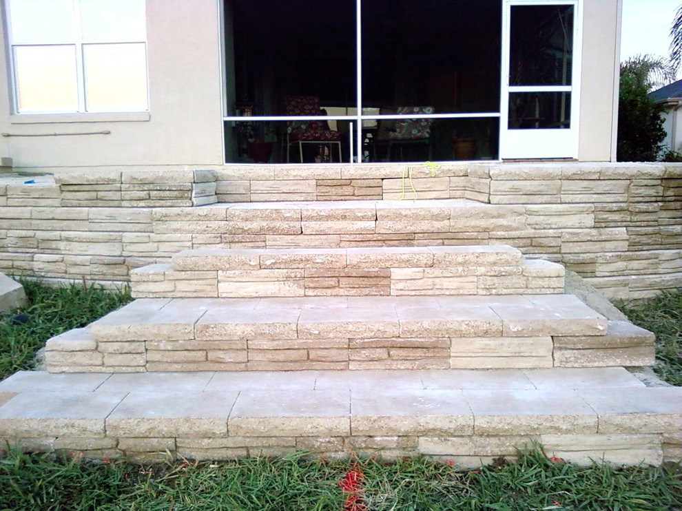 Transitional concrete floor entryway photo in Orlando with beige walls