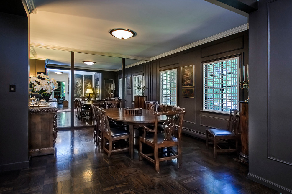 Inspiration for a traditional dining room in San Francisco with black walls and dark hardwood floors.