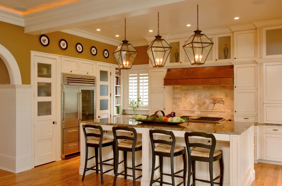 Eat-in kitchen - large transitional l-shaped light wood floor, brown floor and coffered ceiling eat-in kitchen idea in Charleston with white cabinets, multicolored backsplash, stainless steel appliances, an island and multicolored countertops