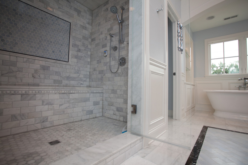 This is an example of a mid-sized traditional master bathroom in Chicago with a freestanding tub, an alcove shower, black tile, gray tile, mosaic tile, multi-coloured walls and mosaic tile floors.