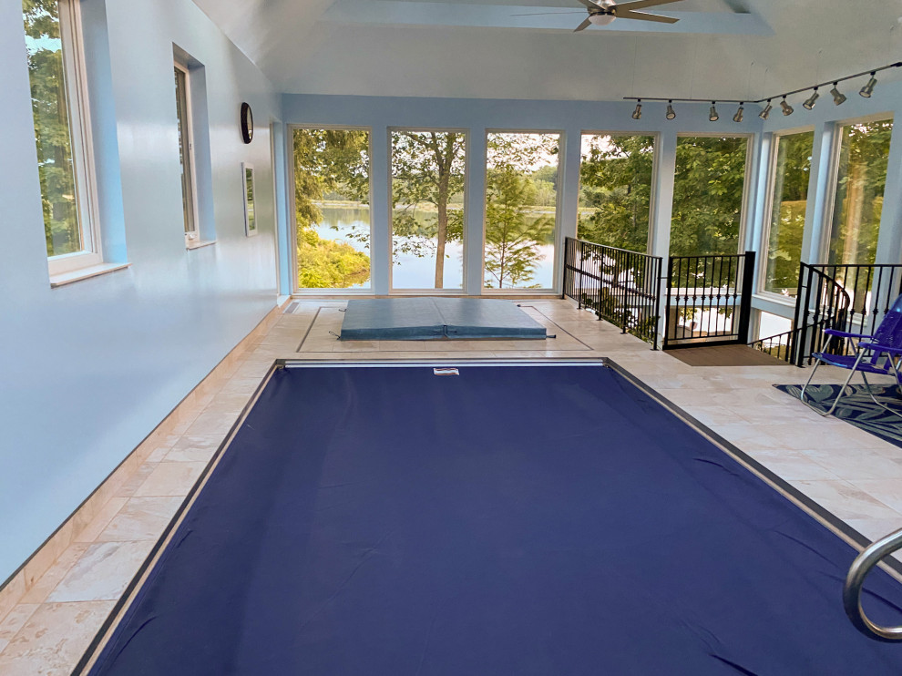 Example of a mid-sized transitional indoor rectangular pool design in Cleveland