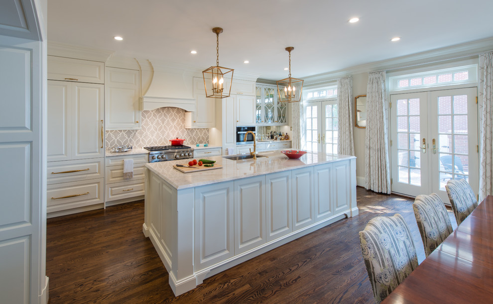 Photo of a large traditional single-wall eat-in kitchen in DC Metro with an undermount sink, beaded inset cabinets, white cabinets, quartzite benchtops, multi-coloured splashback, mosaic tile splashback, stainless steel appliances, medium hardwood floors, with island and brown floor.