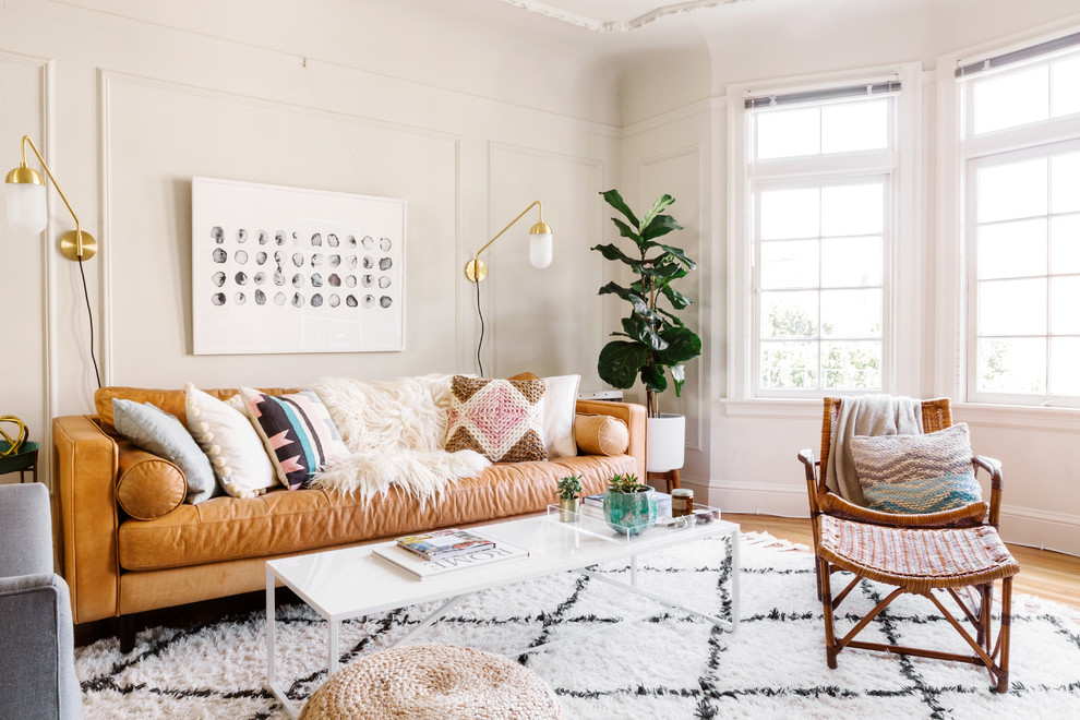 Inspiration for a scandinavian formal living room in San Francisco with white walls and light hardwood floors.