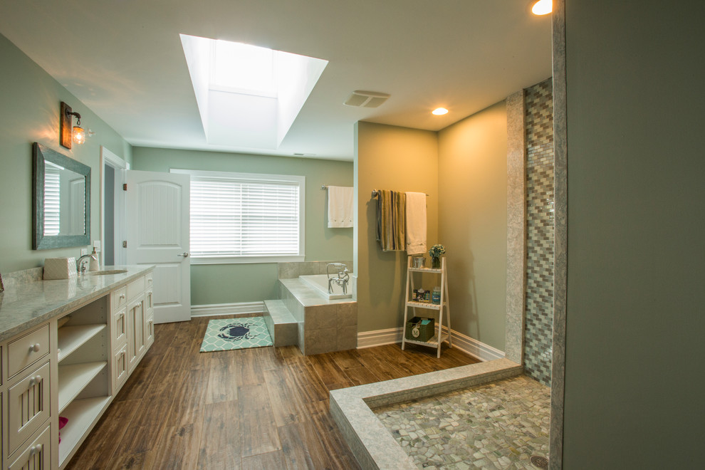 Large country master bathroom in Chicago with an open shower, a two-piece toilet, green walls, ceramic floors, an undermount sink, white cabinets, an alcove tub and marble benchtops.