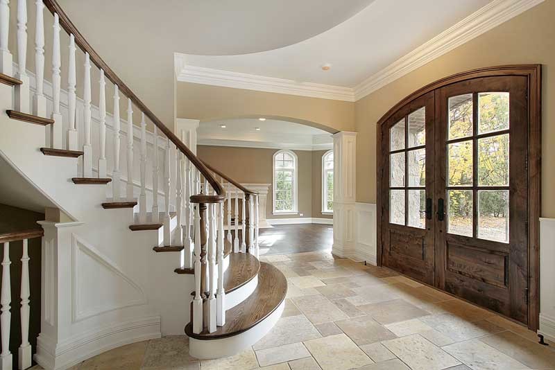 Mid-sized transitional foyer in Dallas with multi-coloured walls, limestone floors, a double front door, a medium wood front door and beige floor.
