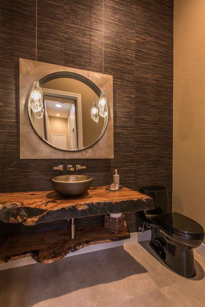 This is an example of a mid-sized contemporary bathroom in Phoenix with open cabinets, brown walls, porcelain floors, a vessel sink, wood benchtops, beige floor and brown benchtops.