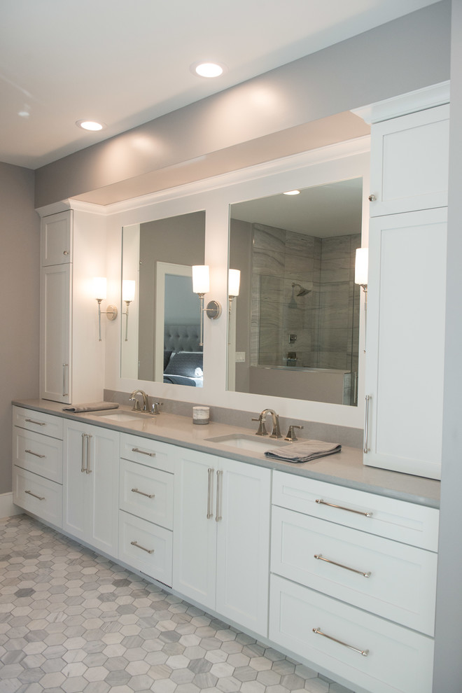 Huge transitional master porcelain tile and gray floor freestanding bathtub photo with shaker cabinets, white cabinets, a one-piece toilet, gray walls, an undermount sink, quartz countertops and gray countertops