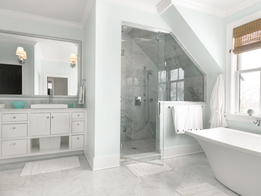 Large transitional master bathroom in Burlington with recessed-panel cabinets, white cabinets, a freestanding tub, an alcove shower, grey walls, marble benchtops, white tile, stone tile and marble floors.