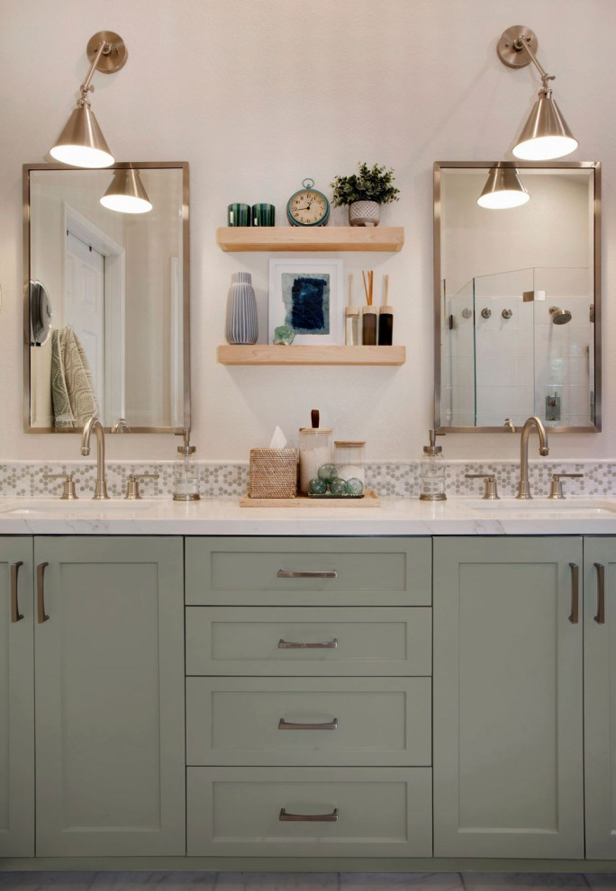 Photo of a mid-sized beach style master bathroom in Orange County with shaker cabinets, green cabinets, a freestanding tub, a corner shower, green tile, mosaic tile, beige walls, marble floors, an undermount sink, engineered quartz benchtops, white floor, a hinged shower door, white benchtops, a shower seat, a double vanity, a built-in vanity and vaulted.