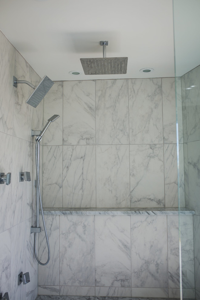 Mid-sized contemporary master wet room bathroom in Omaha with a hot tub, white tile, marble, white walls, porcelain floors, white floor, a hinged shower door and a shower seat.