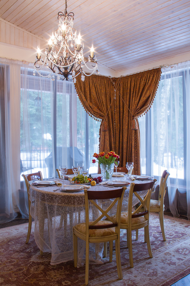Inspiration for a mid-sized traditional dining room in Moscow with beige walls and medium hardwood floors.