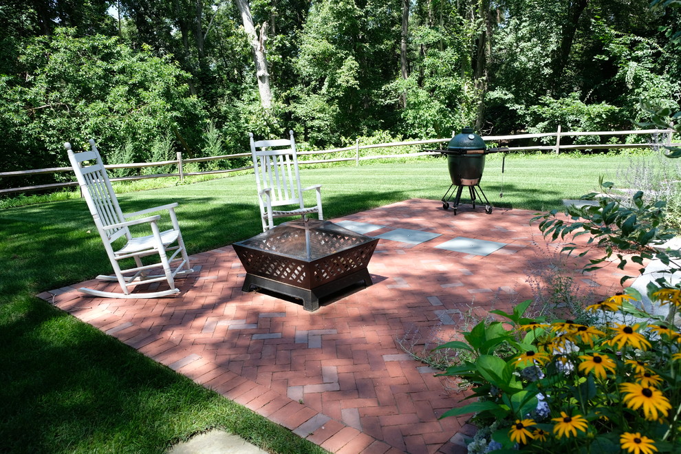 Mid-sized traditional backyard full sun xeriscape in Boston with a garden path and brick pavers for summer.