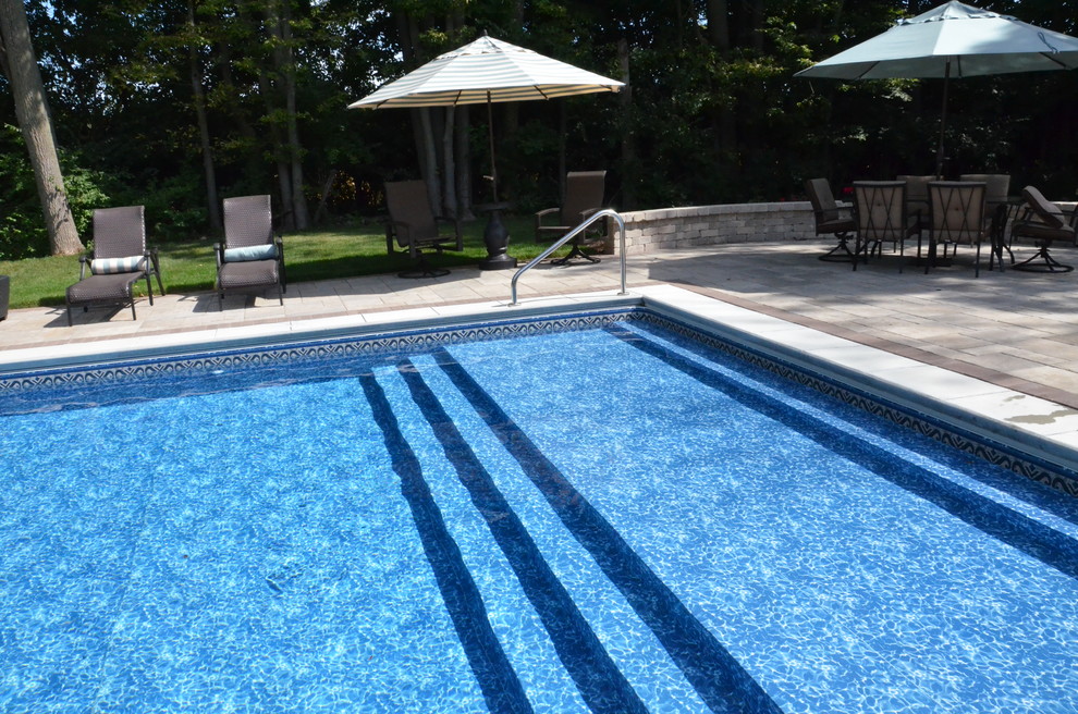 inground pool with sun shelf