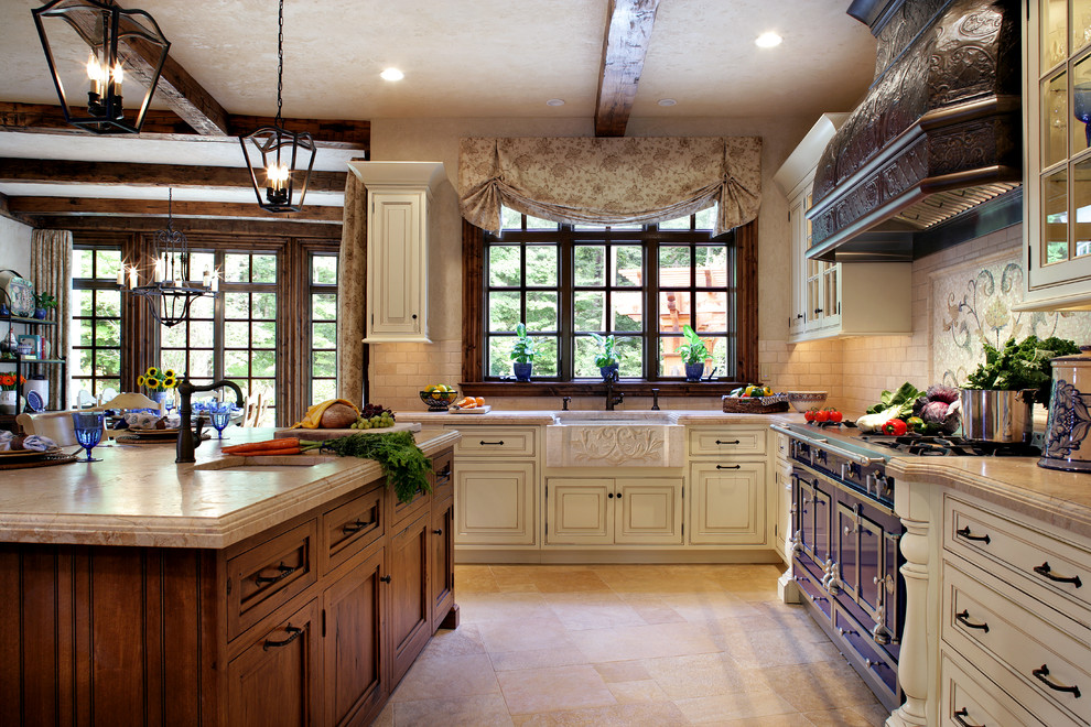 Mid-sized traditional l-shaped eat-in kitchen in New York with a farmhouse sink, beaded inset cabinets, coloured appliances and travertine floors.
