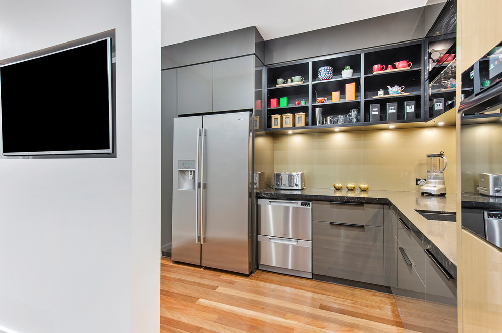 This is an example of a contemporary kitchen in Brisbane with with island.