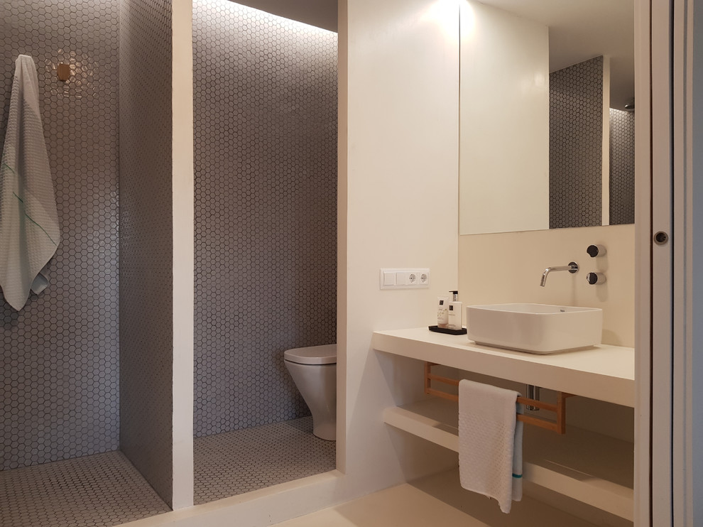 Scandinavian master wet room bathroom in Barcelona with open cabinets, white cabinets, cement tile, concrete floors, a vessel sink, white floor and an open shower.
