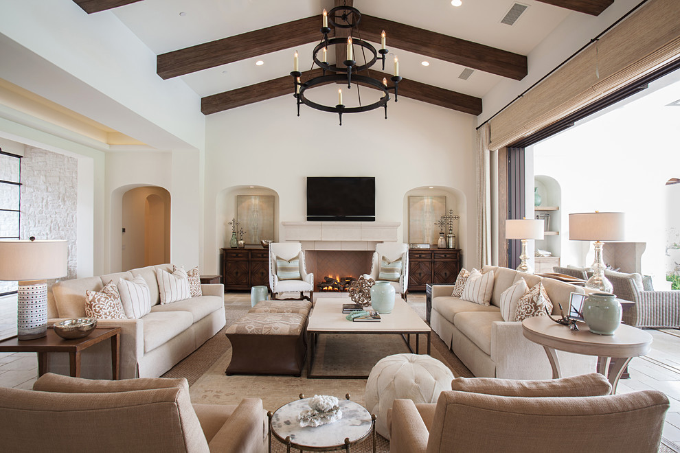 Large transitional formal open concept living room in Los Angeles with white walls, a standard fireplace, a wall-mounted tv and carpet.