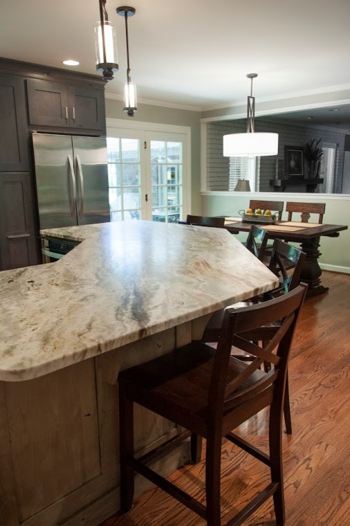 Inspiration for a mid-sized transitional l-shaped eat-in kitchen in Nashville with an undermount sink, grey cabinets, marble benchtops, grey splashback, stone tile splashback, stainless steel appliances, medium hardwood floors, with island, shaker cabinets, brown floor and multi-coloured benchtop.