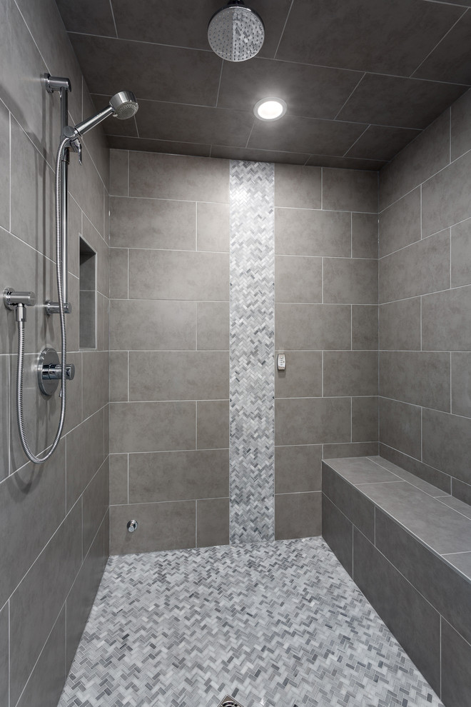 This is an example of a large transitional master bathroom in Vancouver with shaker cabinets, white cabinets, a freestanding tub, an alcove shower, gray tile, porcelain tile, grey walls, porcelain floors, an undermount sink, engineered quartz benchtops, grey floor, a hinged shower door and grey benchtops.