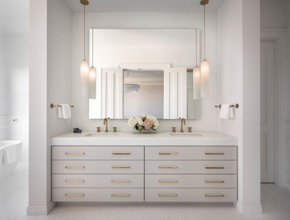 This is an example of a transitional bathroom in San Francisco with white walls, mosaic tile floors, marble benchtops and white floor.