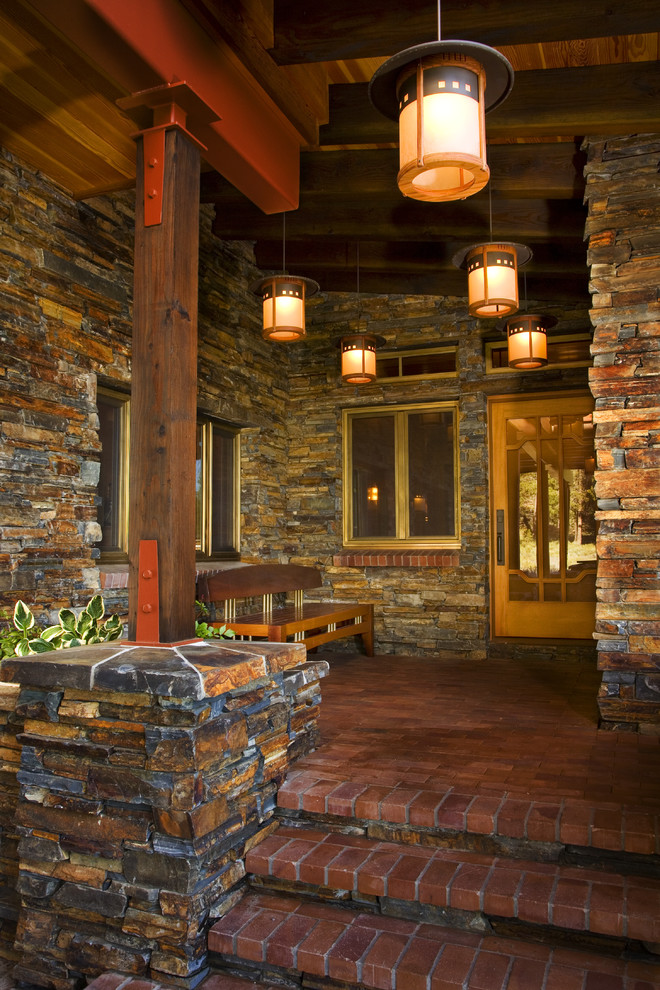 This is an example of a traditional entryway in Sacramento with a single front door and a medium wood front door.