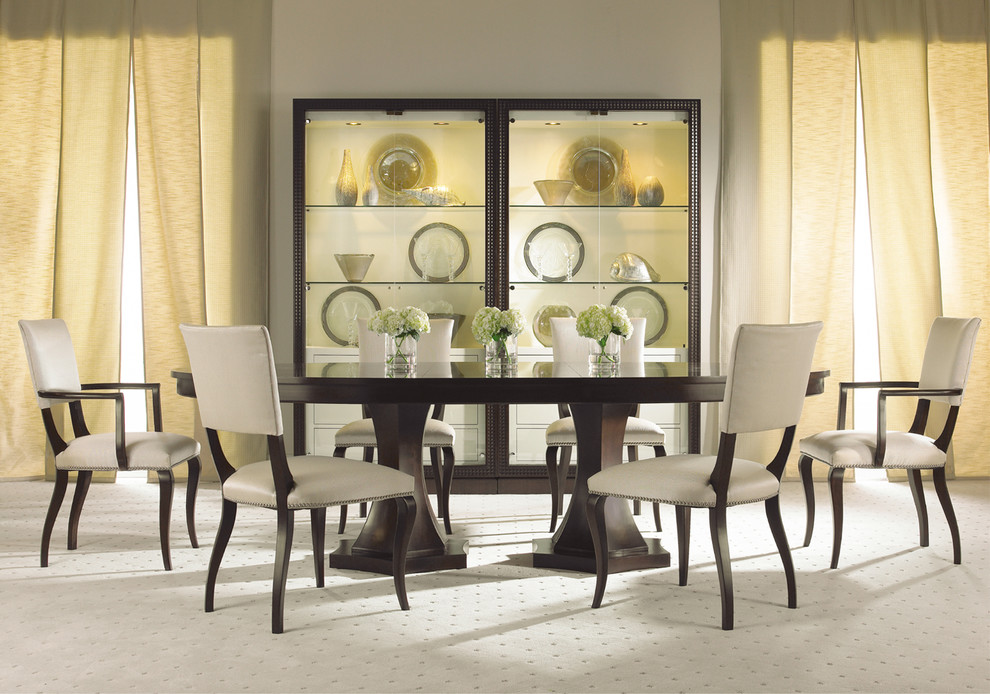 Photo of a large contemporary separate dining room in Other with beige walls and carpet.