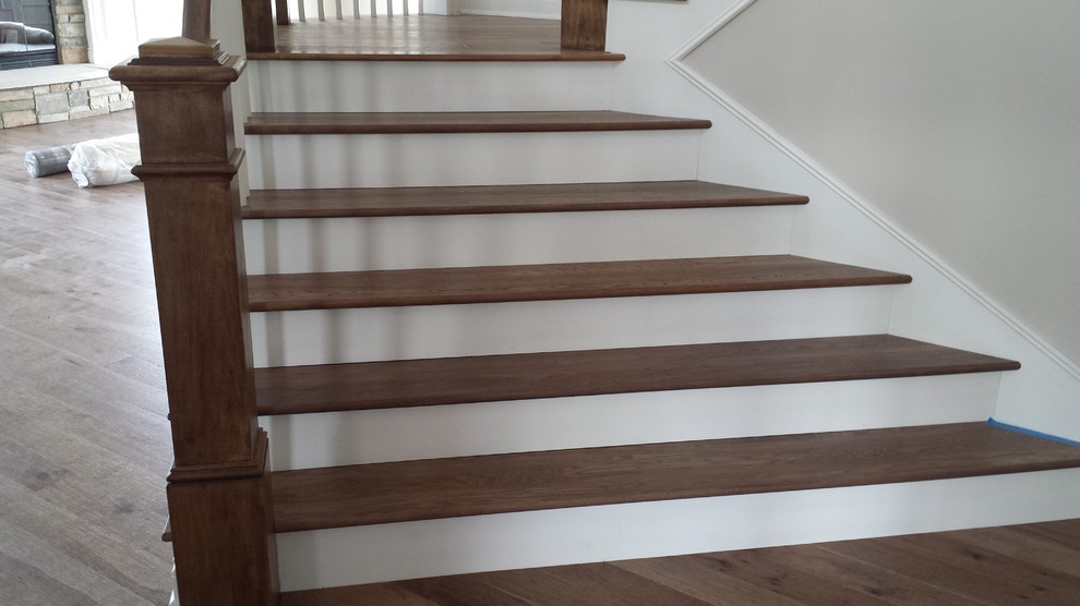 Inspiration for a large arts and crafts wood l-shaped staircase in Detroit with wood risers and wood railing.